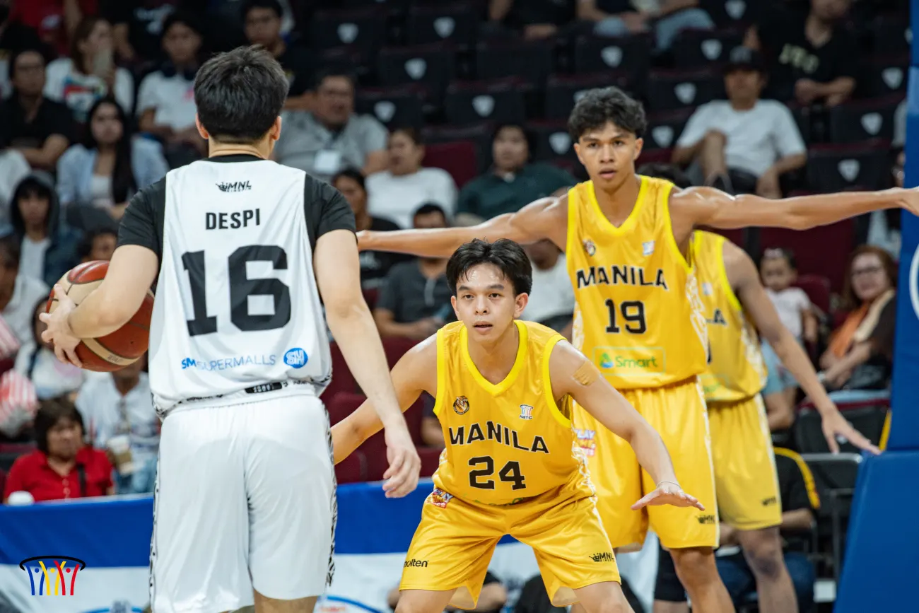 A UST–Manila guard attacks off the dribble