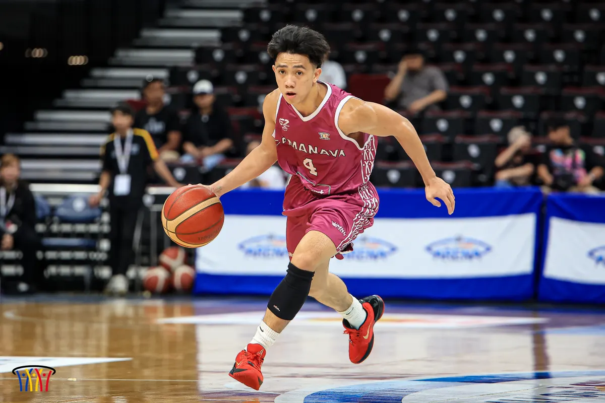 A CAMANAVA guard pushes the ball up the floor