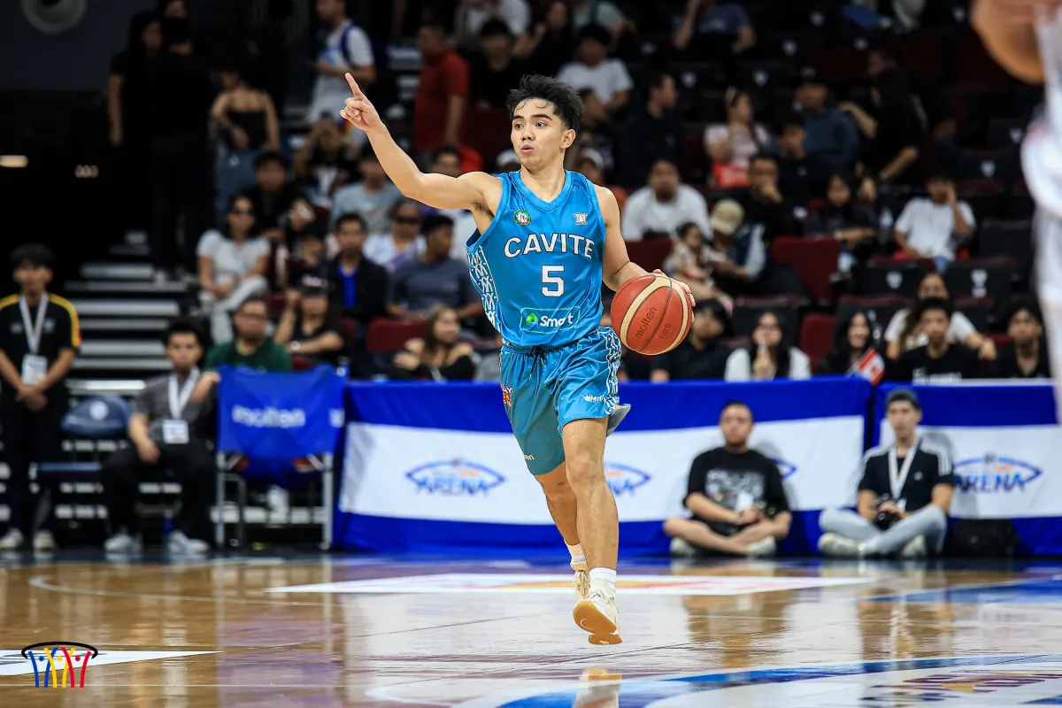 A Cavite guard directs the offense during an NBTC National Finals game